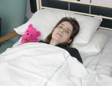 Very ill, waiting for a brain scan.
